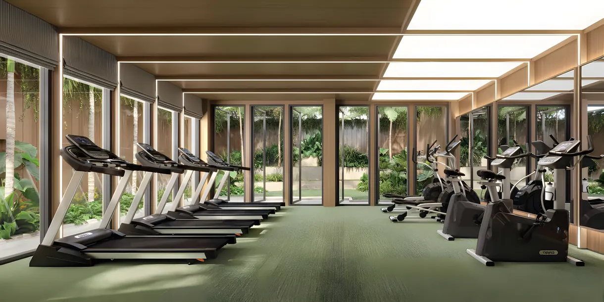 Salle de sport vitrée de la résidence ouverte sur les jardins