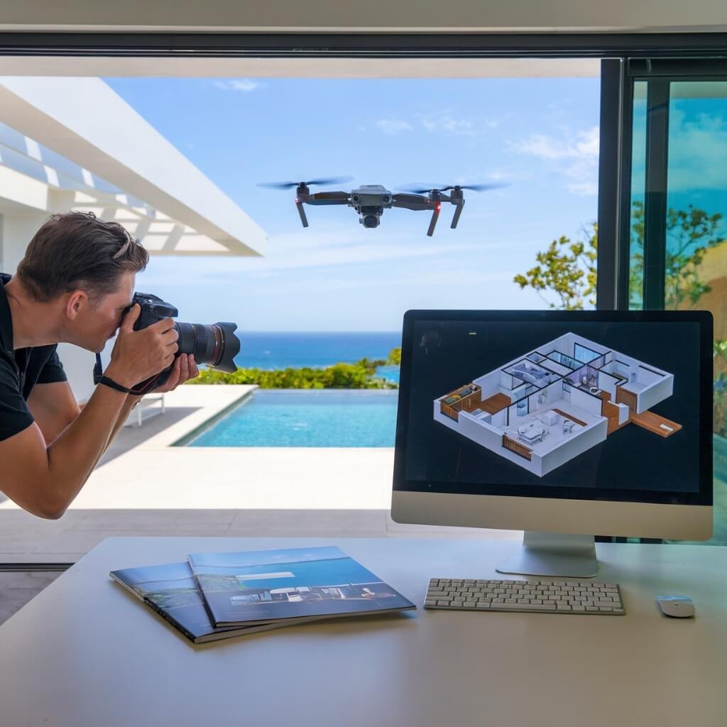 Professional photographer and drone capturing a luxury villa in Koh Samui, with a laptop displaying a 3D floor plan and a high-end real estate brochure