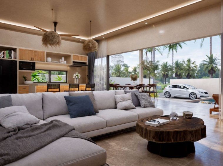 Pièce de vie villa Koh Samui – grand séjour lumineux avec canapé sectionnel, baies vitrées coulissantes et vue sur palmiers
